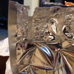 Word of Advice: Do not have the heat setting on high and do not leave the iron on longer than a second or this will happen. I had melted holes in my bag, then had to cut and reseal it, until I mastered it. My first one was jacked up. LOL