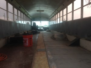 From the Rear with all the seats out and almost all the flooring gone!