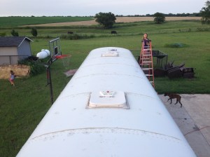 FINISHED! From front to back of roof. My helper on the 20 ft ladder:)